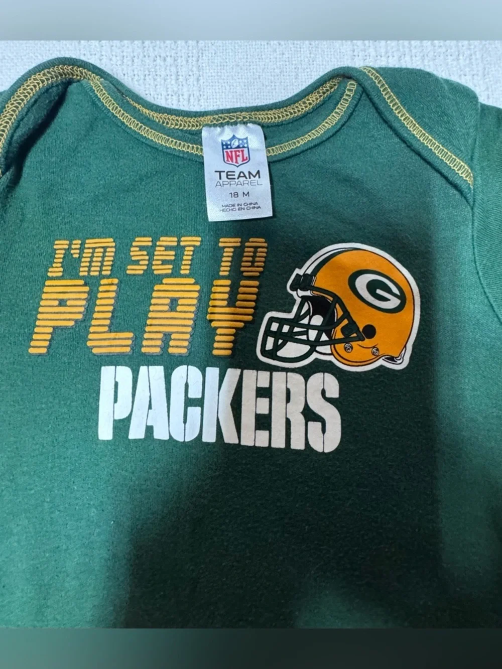NFL Green Packers 'I'm Set to Play' Baby One-Piece with Yellow Helmet Unixes.